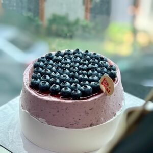 Blueberry Cream Cheese Cake with blueberry glaze and vanilla sponge