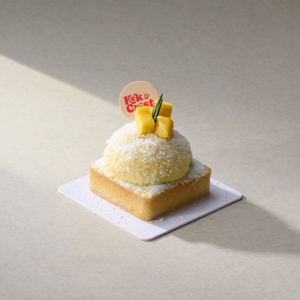 mango coconut cream tart with mango cubes and shredded coconut on top