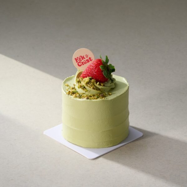Pistachio Strawberry Petite Cake topped with pistachio cream, nuts, and fresh strawberry – Kek & Crust