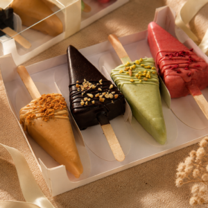 4-Piece Cheesecake Cakesicles Gift Box by Kek & Crust with handcrafted premium cheesecake desserts.