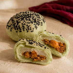 Pandan 3Q mooncake cross-section with pandan paste, mochi and salted egg chicken floss